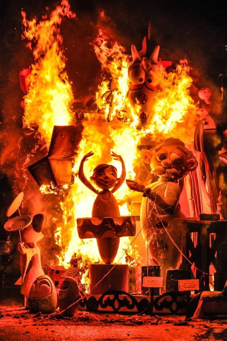 A falla monument engulfed in flames on the night of the cremà
