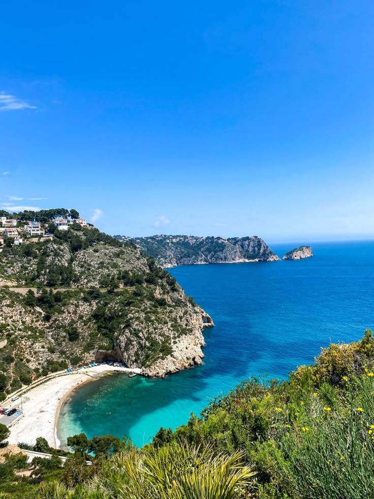 The cove of La Granadella in Jávea, turquoise water below pine-covered cliffs